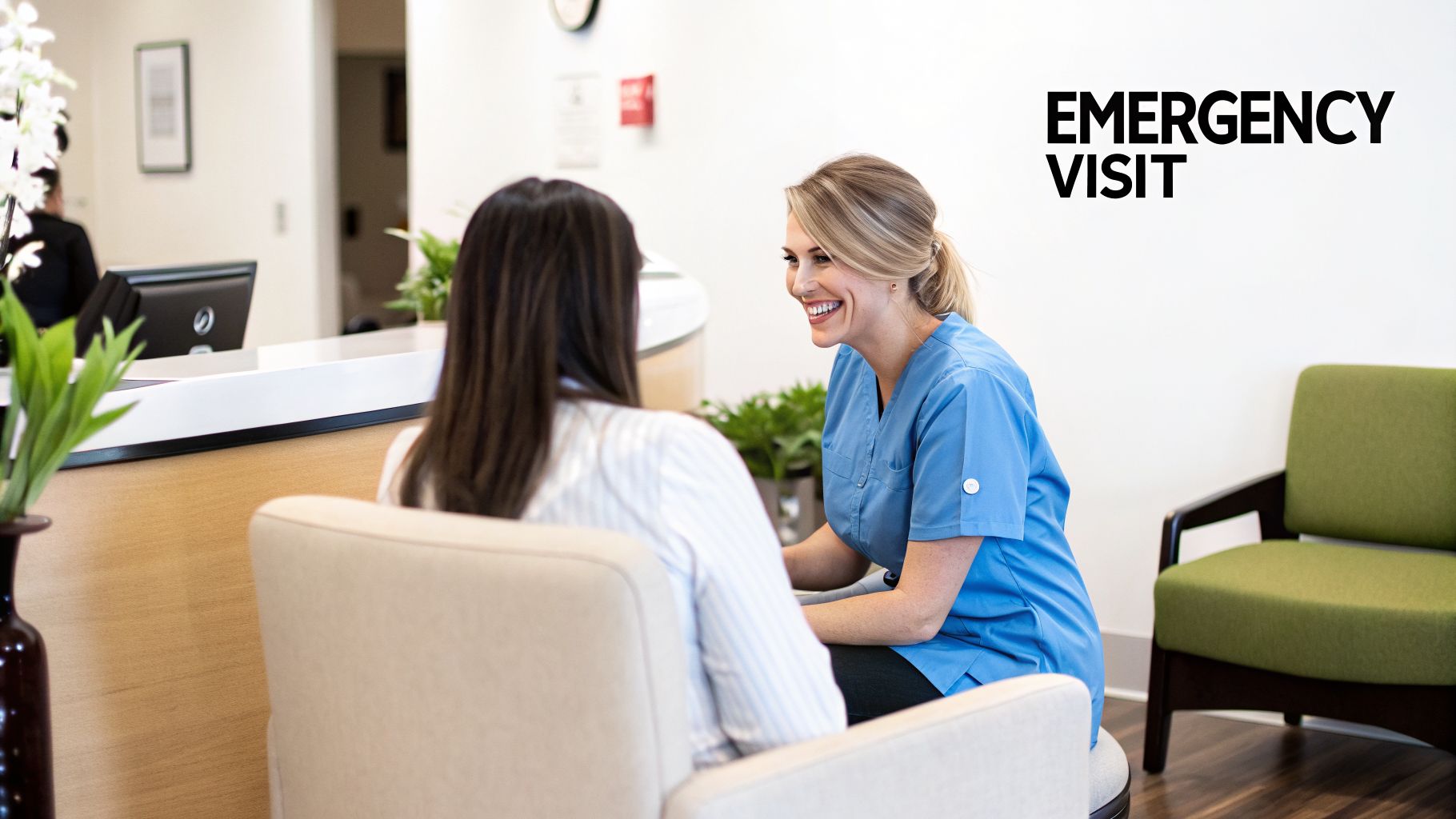 A smiling healthcare professional in blue scrubs talks to a patient during an emergency visit.